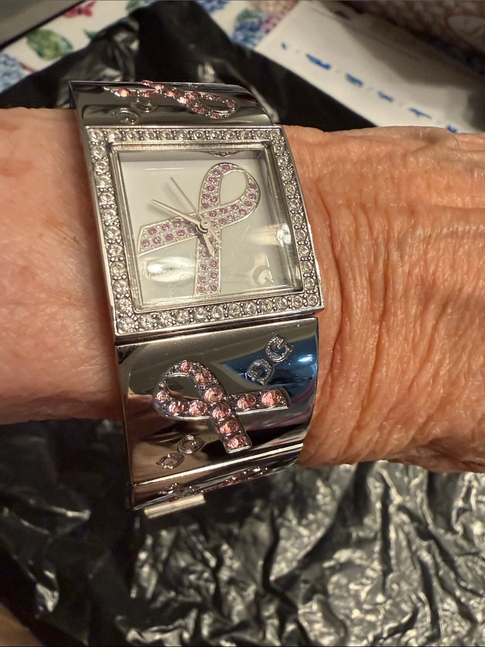 GUESS Silver-Tone Women's Bracelet Watch with Pink Ribbon Accents